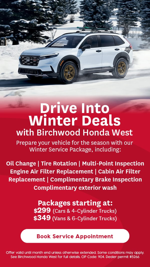 A white Honda SUV drives on a snowy road surrounded by trees. Text below promotes Birchwood Honda West’s Winter Service Package under the headline “Drive Into Winter Deals,” listing services like oil change, tire rotation, and inspections, with prices starting at $299 and a white “Book Service Appointment” button at the bottom.