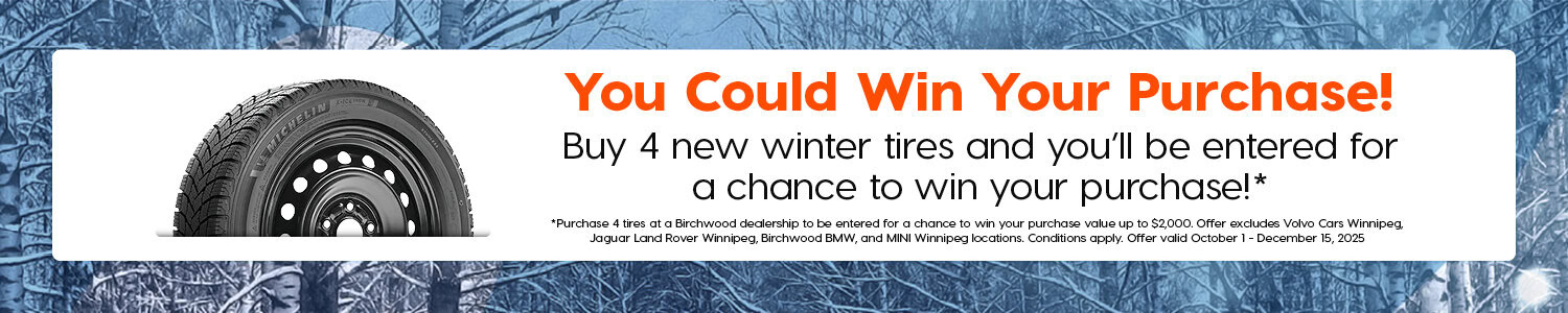 Promotional banner with a winter forest background and an image of a Michelin winter tire. Text reads, “You Could Win Your Purchase! Buy 4 new winter tires and you’ll be entered for a chance to win your purchase!*” Fine print below explains that the offer is valid at select Birchwood dealerships from October 1 to December 15, 2025, with a maximum prize value of $2,000.